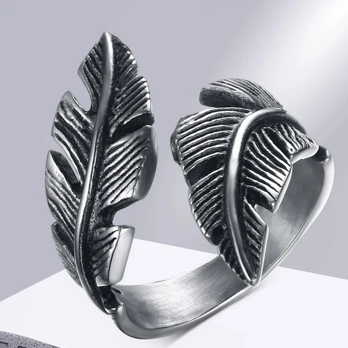 Adjustable silver-tone feather ring