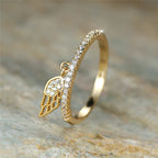 Ring with angel wing pendant gold