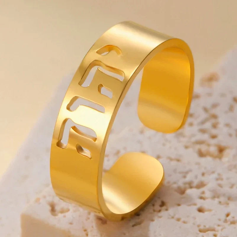 Wide ring with Hebrew engraving in gold