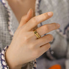 Wide ring with Hebrew letters in gold