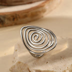 Wide textured spiral ring in silver