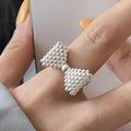 Bow tie and pearl ring