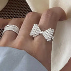 Bow tie and pearl ring