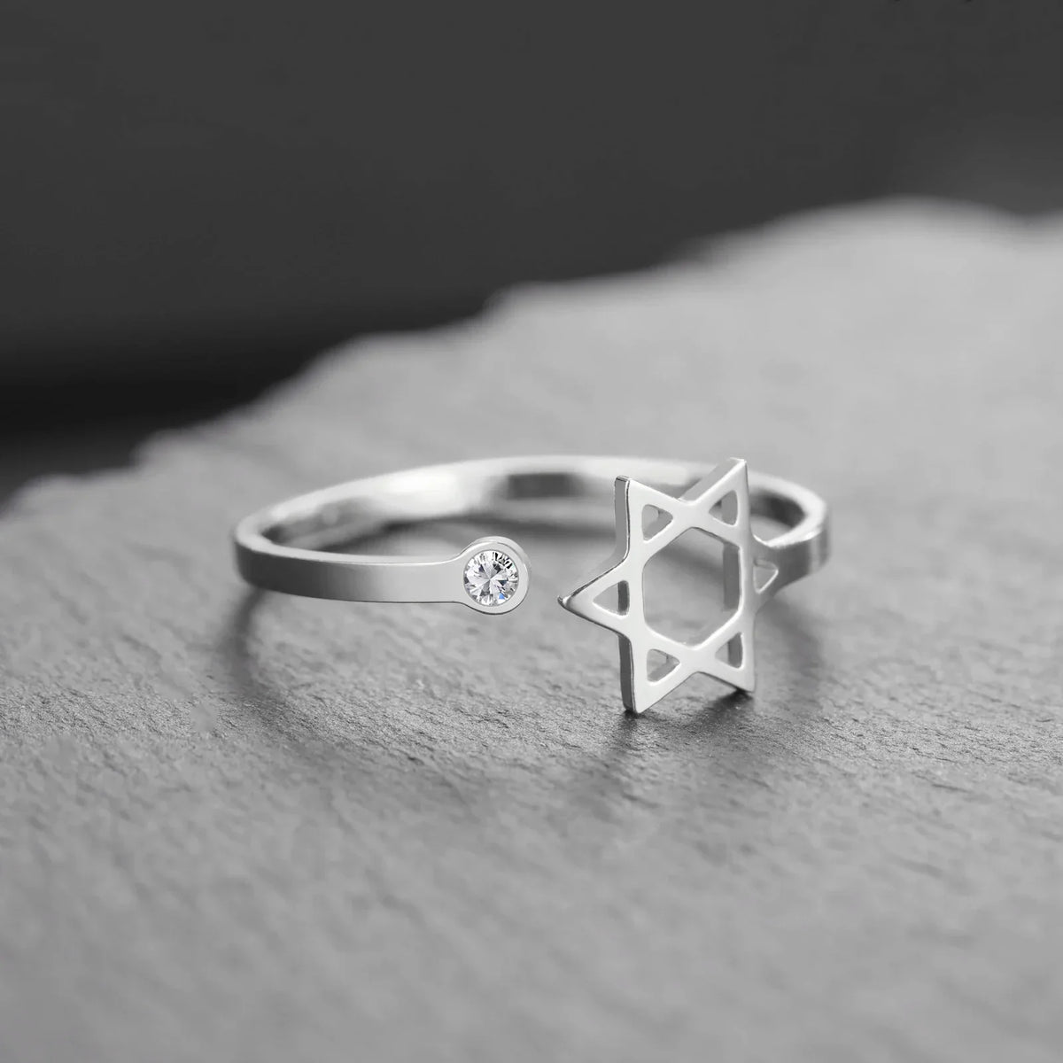 Open ring with a symbolic Jewish Star of David in silver