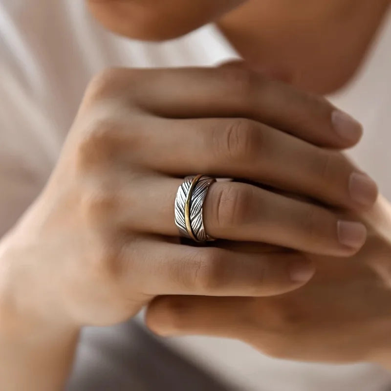 Open feather-shaped ring