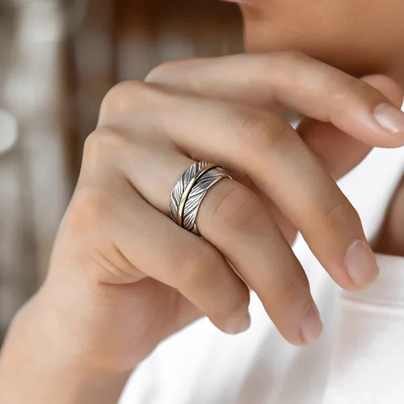 Open feather-shaped ring