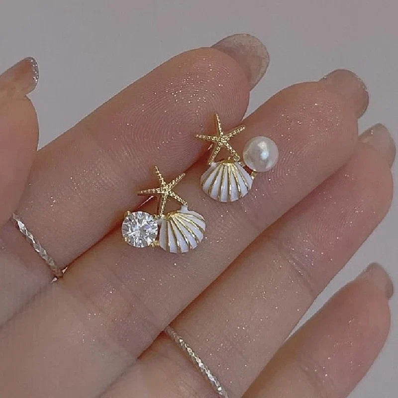 Asymmetrical white shell earrings