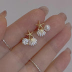 Asymmetrical white shell earrings