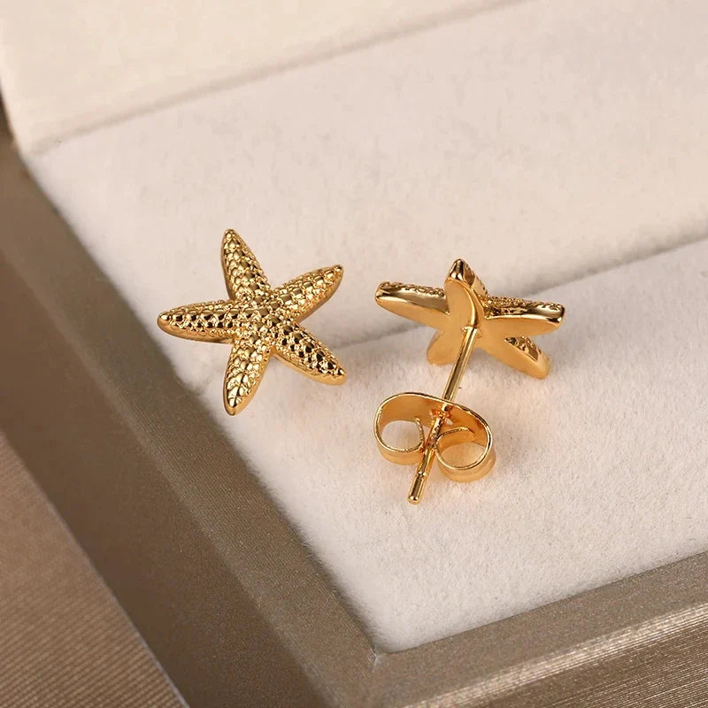 Women’s shell earrings with starfish, gold