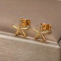 Women’s shell earrings with starfish, gold