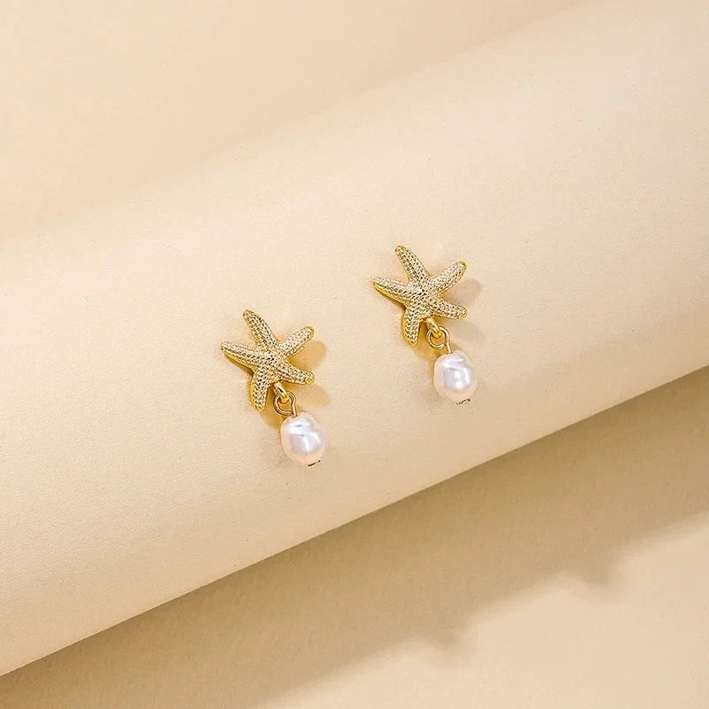 Gold-tone shell, starfish and pearl earrings