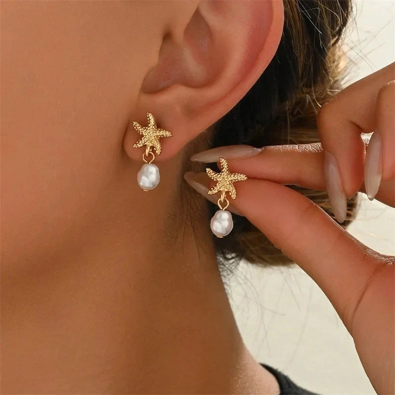 Gold-tone shell, starfish and pearl earrings