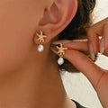 Gold-tone shell, starfish and pearl earrings