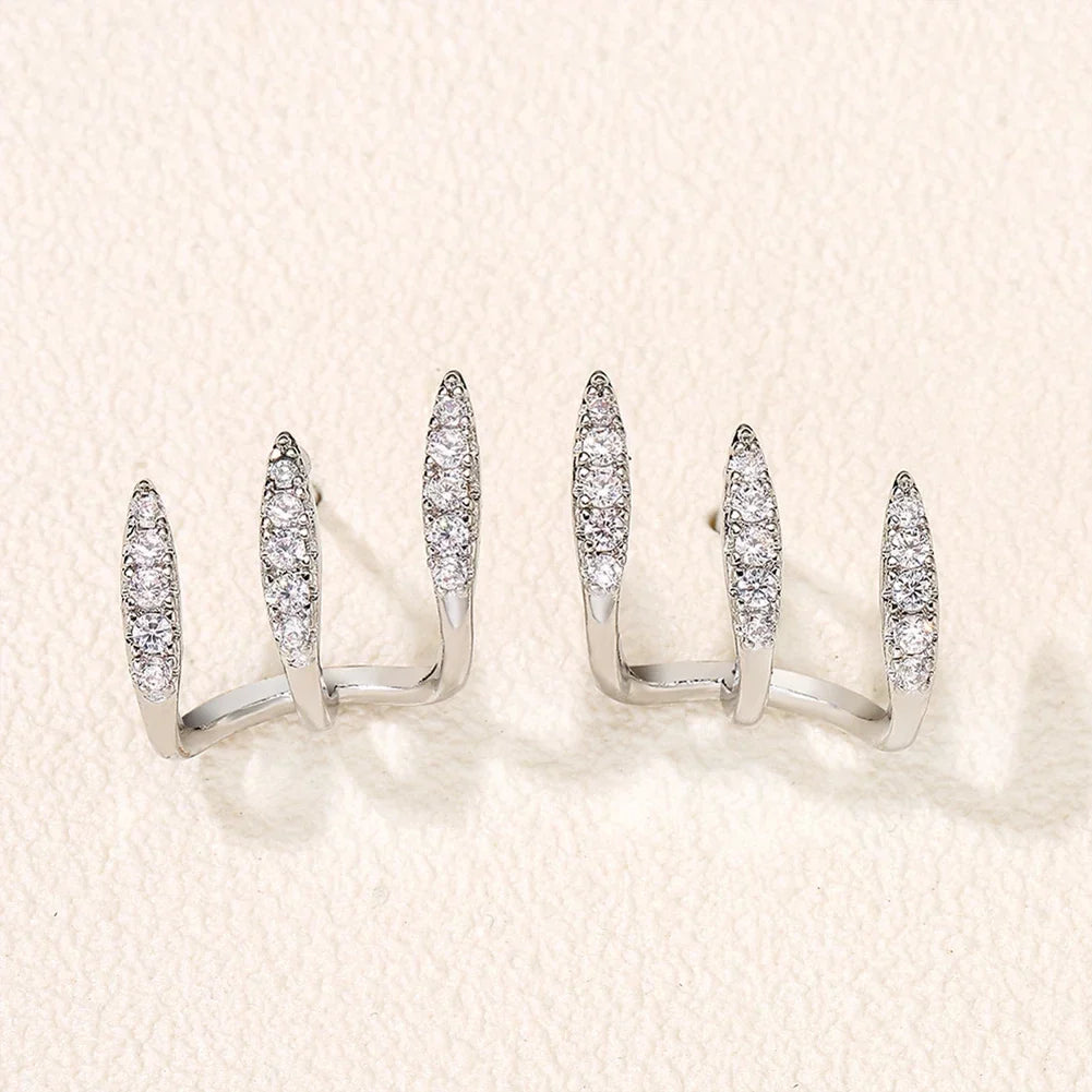 Elegant earrings with three-prong rhinestones