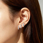 Elegant earrings with three-prong rhinestones