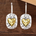 Heart-shaped earrings in silver and gold tones