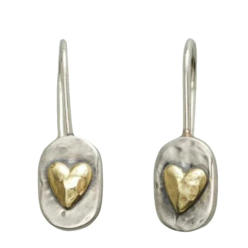 Heart-shaped earrings in silver and gold tones