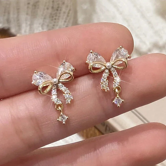 Women's gold bow earrings