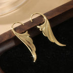 Gold angel wing drop earrings for women