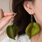 Dangling Earrings with Green Colored Leaf