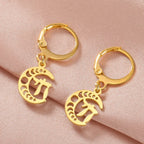 Drop earrings with the Chai symbol of life on a gold crescent moon