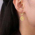 Drop earrings with the Chai symbol of life on a gold crescent moon