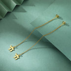 Dangling earrings with the Jewish life symbol Chai in gold