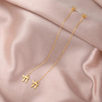 Dangling earrings with the Jewish life symbol Chai in gold