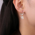 Dangle earrings with the Jewish Chai symbol, silver