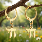 Dangle earrings with the Jewish Chai symbol, gold