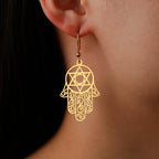 Dangle earrings with the Jewish protective symbol, Hand of Fatima and Star of David in gold