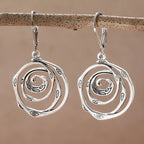 Dangling earrings with a chiseled spiral