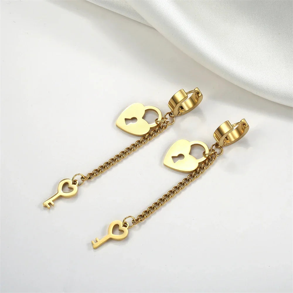 Gold key and lock dangling earrings