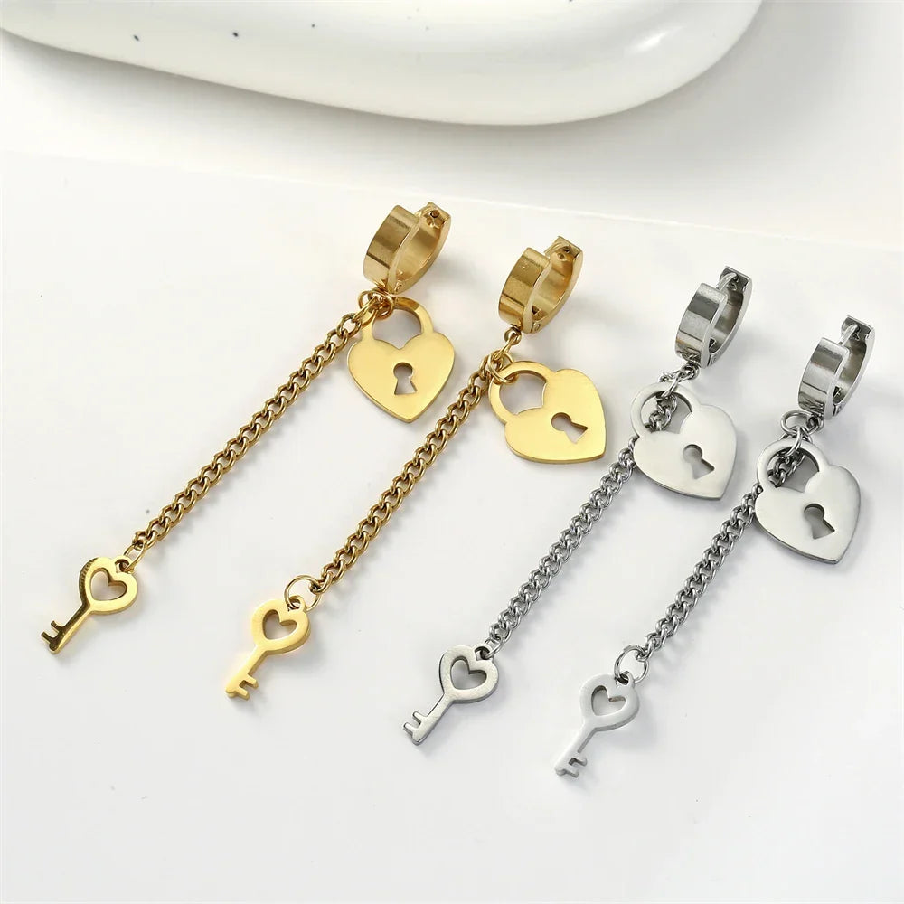 Gold key and lock dangling earrings