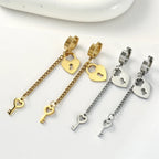 Gold key and lock dangling earrings