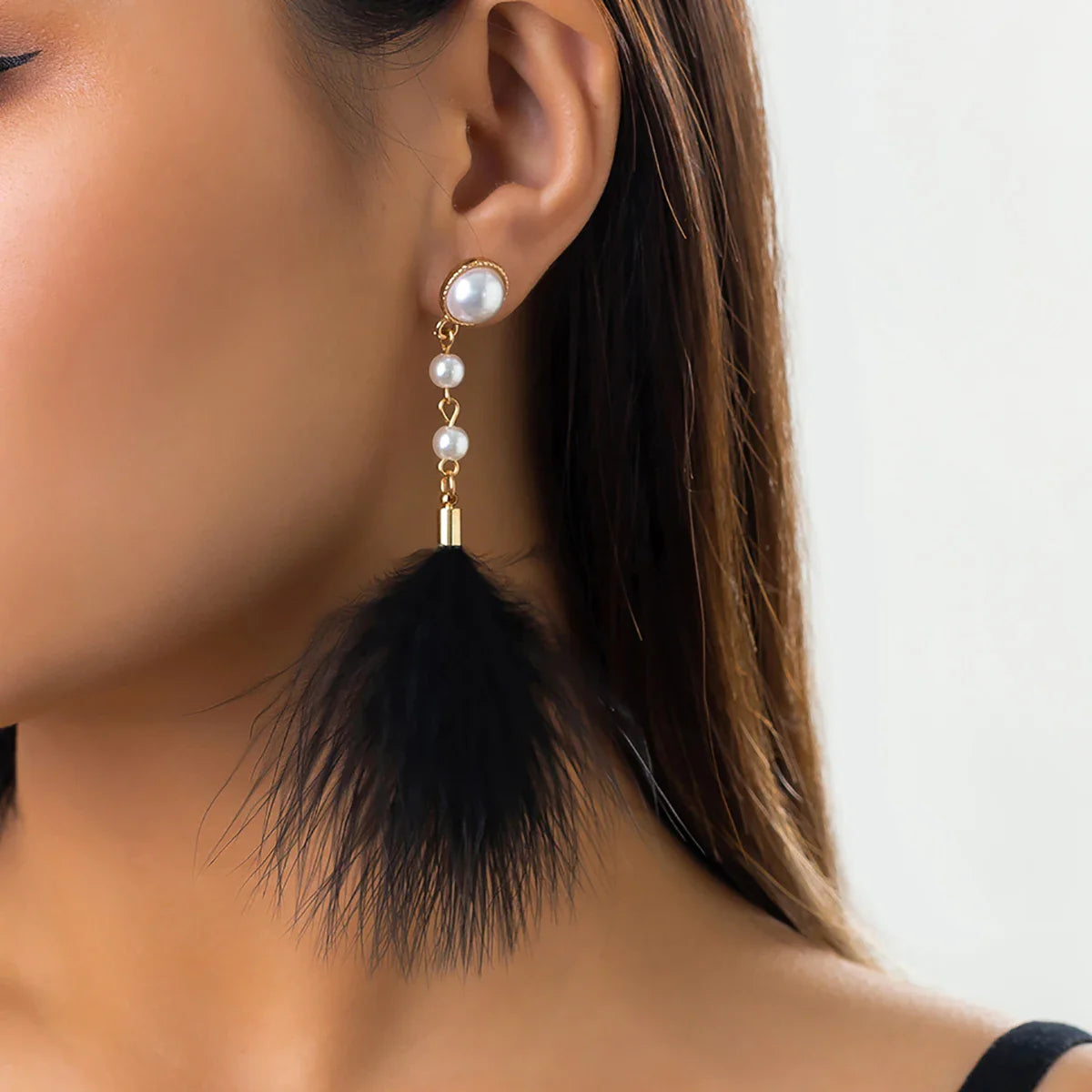 Dangling Earrings with Pearls and Feathers