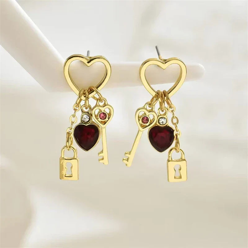 Women’s dangle earrings with keys and padlocks