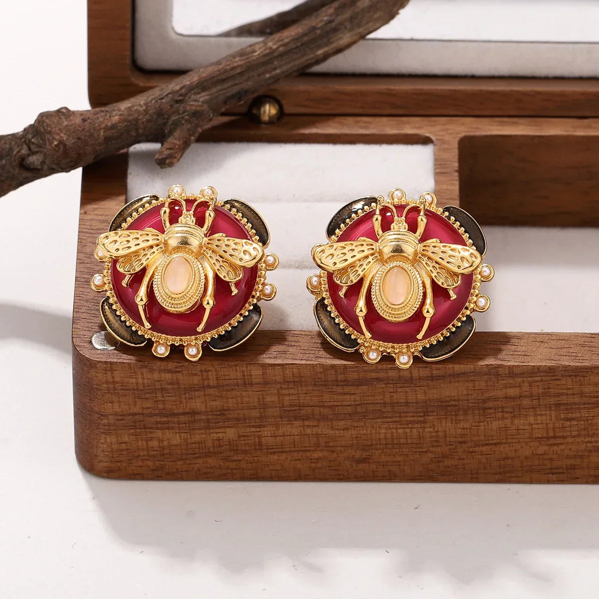 Round bee earrings red