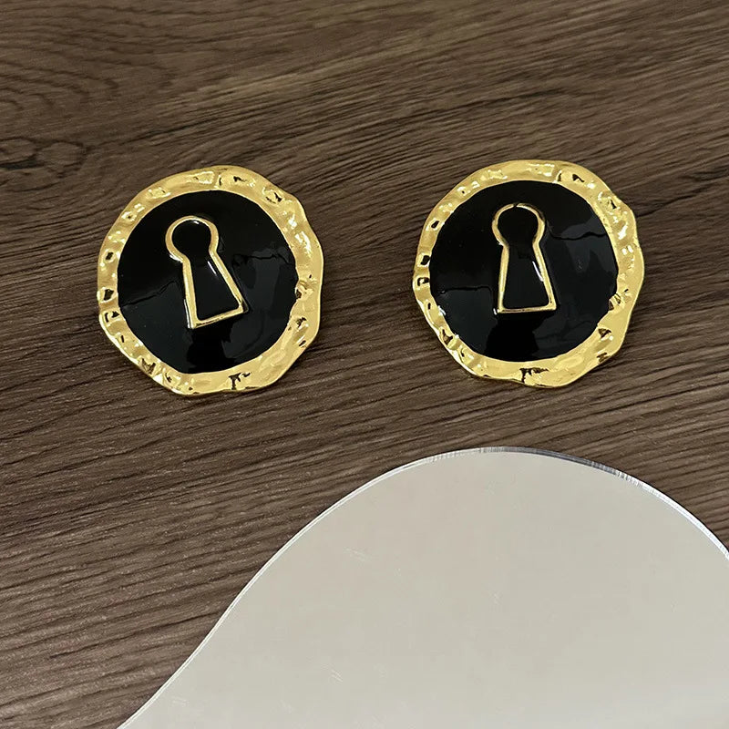 Round black key hoop earrings