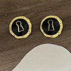 Round black key hoop earrings