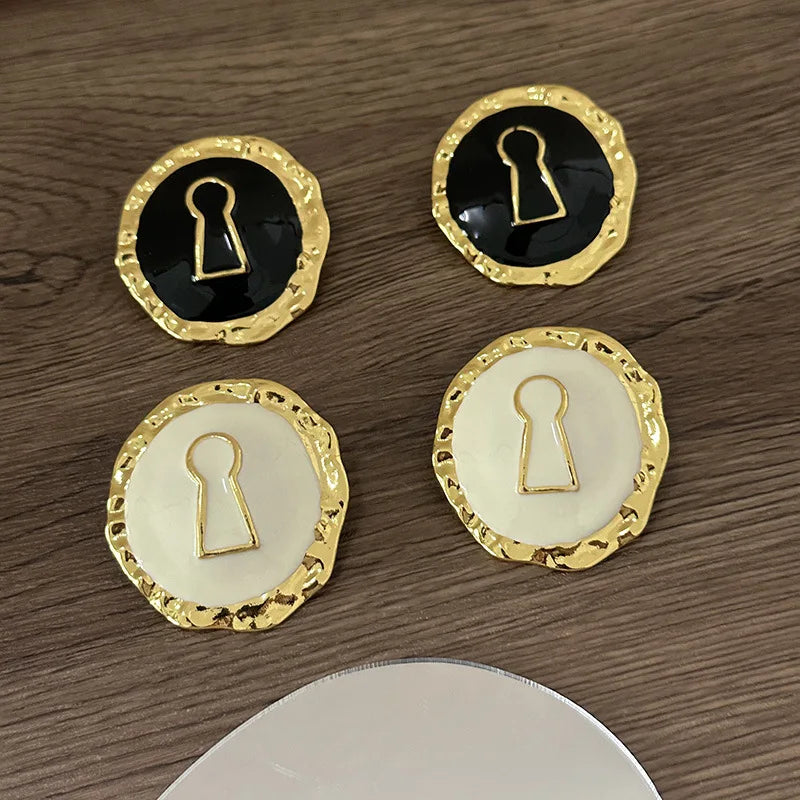 Round key hoop earrings