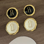 Round key hoop earrings