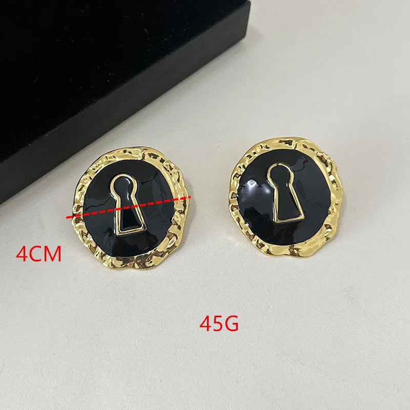 Round key hoop earrings