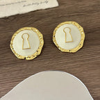 Round white key hoop earrings