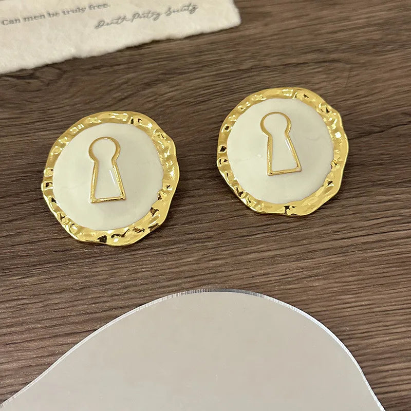 Round white key hoop earrings