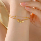 Adjustable angel wings bracelet gold