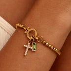 Bracelet with cross and December birthstone
