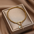 Bracelet with cross and birthstone
