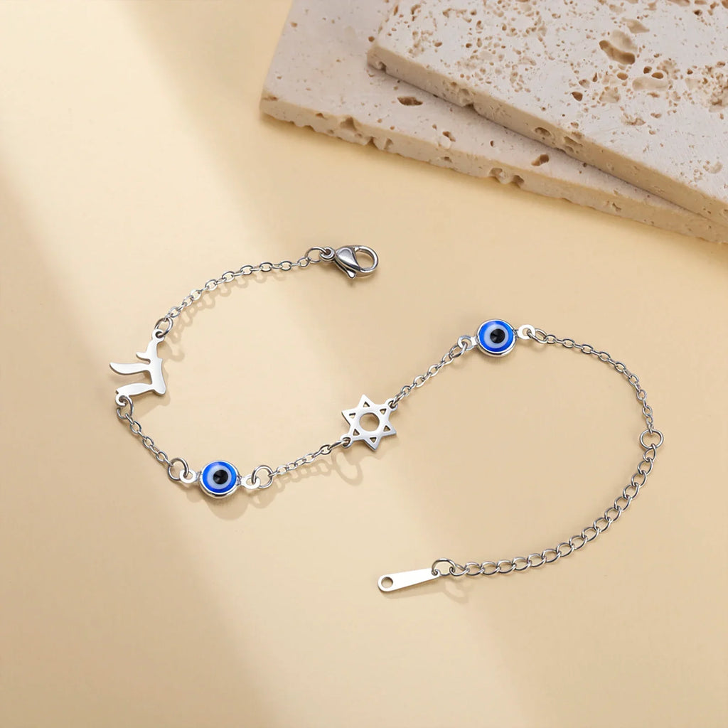 Bracelet with protective symbols: blue eye, Chai, and the Star of David in silver