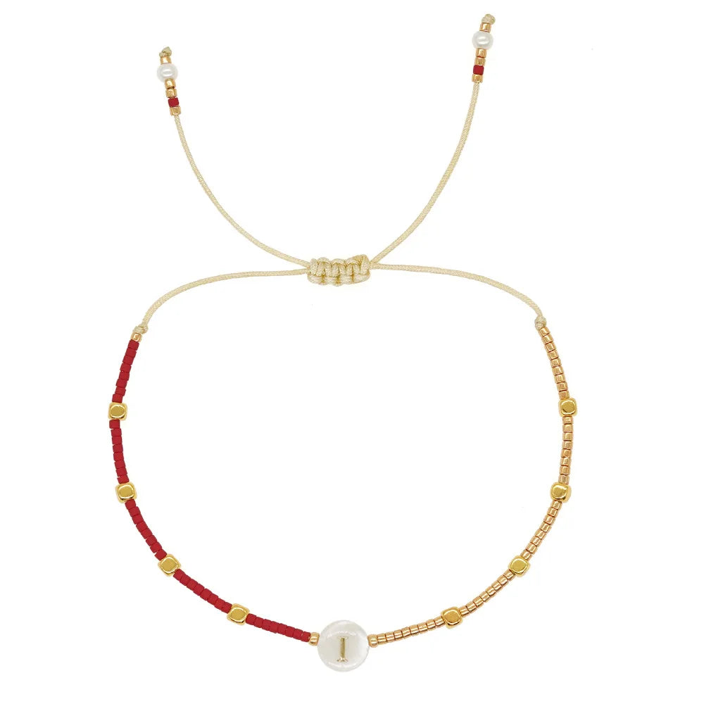 Two-tone initial bracelet i